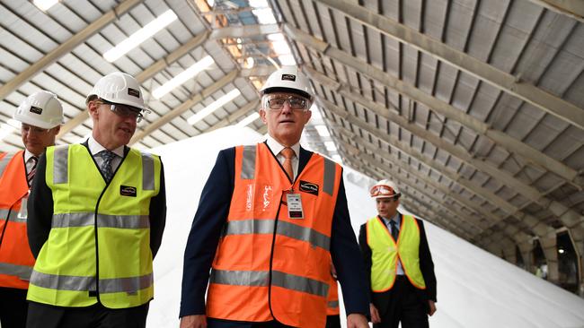 Prime Minister Malcolm Turnbull, second right, is escorted by Incitec Pivot Fertilisers chief James Fazzino, second left, during a visit to an Incitec facility in Brisbane in April. (Picture: AAP)