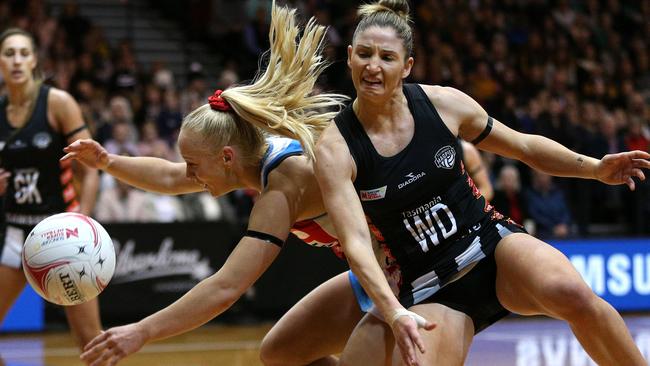 Kim Ravaillion stays in close contact with Tayla Fraser during a fierce battle between the Swifts and the Magpeis this season.