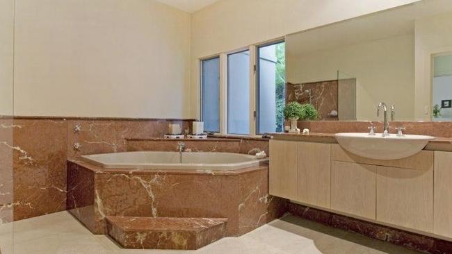 The bathroom with a large spa bath.