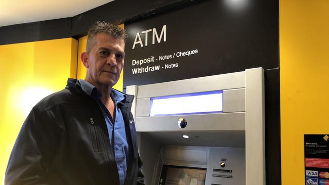 Jarrod Ruppell at the Commonwealth Bank Pendle Hill. Not even ATMs will remain.