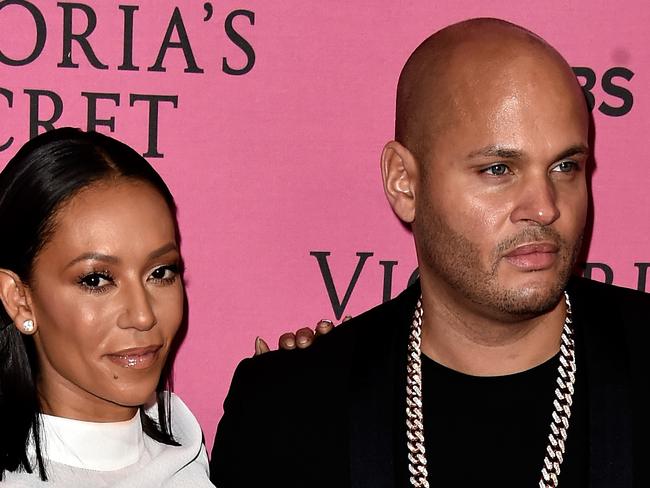 LONDON, ENGLAND - DECEMBER 02: Melanie Brown and Stephen Belafonte attend the annual Victoria's Secret fashion show at Earls Court on December 2, 2014 in London, England. (Photo by Pascal Le Segretain/Getty Images)