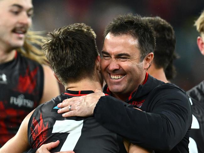 MELBOURNE, AUSTRALIA - MAY 20: Bombers head coach Brad Scott celebrates winning with Zach Merrett during the round 10 AFL match between Essendon Bombers and Richmond Tigers at Melbourne Cricket Ground, on May 20, 2023, in Melbourne, Australia. (Photo by Quinn Rooney/Getty Images)