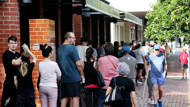 People lined up at Centrelink in Cairns CBD. Picture: Stewart McLean