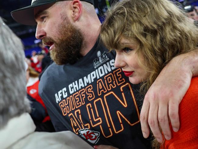 (FILES) Travis Kelce #87 of the Kansas City Chiefs (L) celebrates with Taylor Swift after defeating the Baltimore Ravens in the AFC Championship Game at M&amp;T Bank Stadium on January 28, 2024 in Baltimore, Maryland. You knew Taylor Swift was influential, but Republicans are now crediting the singer with James-Bond-villain-level powers in a wacky conspiracy theory claiming the singer's romance with NFL star Travis Kelce is really a plot to rig the Super Bowl and get President Joe Biden re-elected. The relationship between the pop powerhouse and the Kansas City Chiefs tight end has gripped the nation for weeks, with TV cameras repeatedly panning from the field during the team's surging NFL season to a cheering Swift in the stands. (Photo by Patrick Smith / GETTY IMAGES NORTH AMERICA / AFP)