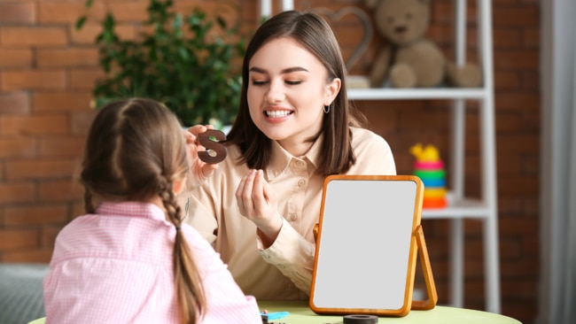 Speech pathology, pathologist with young girl. Picture: Pixelshot