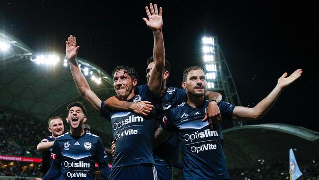 Mark Milligan, centre, said he found a new lease on life after rejoining Melbourne Victory at the urging of former coach Ange Postecoglou. Picture: Getty Images