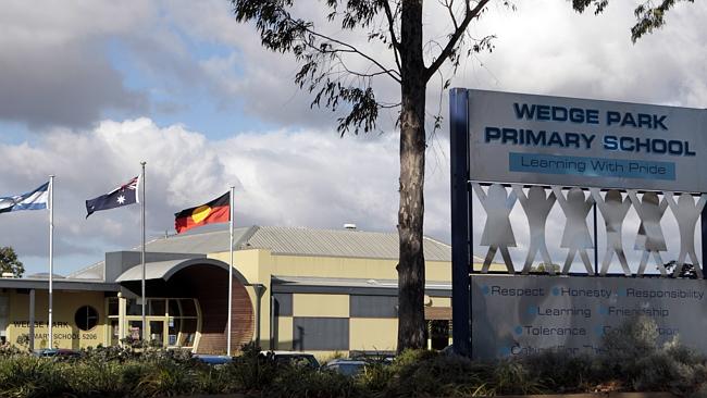 Children line up to get into school gates | Herald Sun