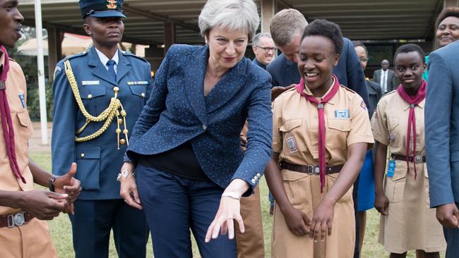 Prime Minister Theresa May in breaks into dance whilst meeting with scouts at the United Nations offices in Nairobi on the third day of her visit to Africa. (Photo by Stefan Rousseau/PA Images via Getty Images)