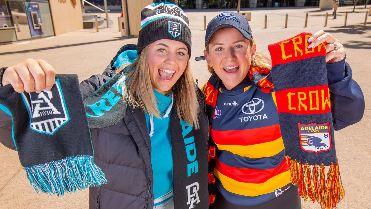 Port diehard Stephanie Way with Crows fanatic Daniela Karantonis outside Adelaide Oval, ready for the new season. Picture: Ben Clark