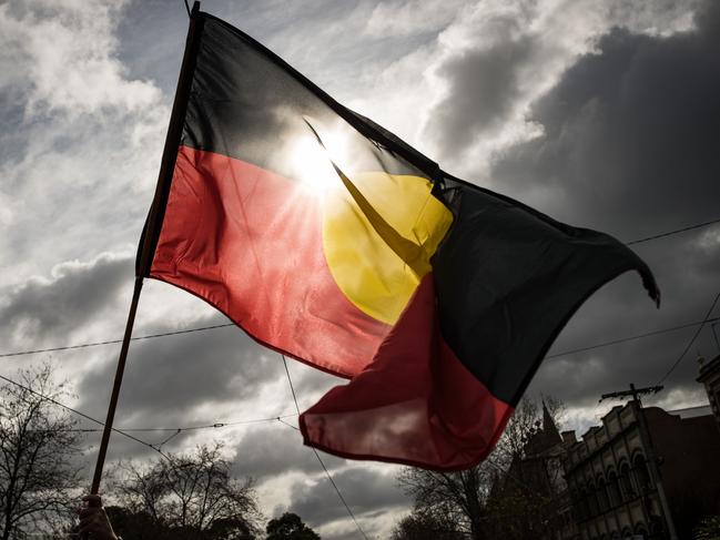 MELBOURNE, AUSTRALIA - JULY 07: The Aboriginal flag is seen flying during the NAIDOC March on July 07, 2023 in Melbourne, Australia. NAIDOC Week is an Australian observance lasting from the first Sunday in July until the following Sunday. The acronym NAIDOC stands for National Aborigines and Islanders Day Observance Committee. The week is intended as a time when all Australians can reflect on the rich history of the country's indigenous peoples, and learn about the cultures and histories of first nations groups. (Photo by Darrian Traynor/Getty Images)