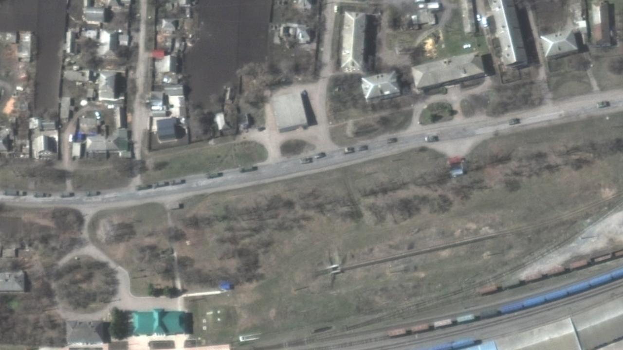 Convoy of armoured vehicles and trucks. Satellite image: Maxar Technologies