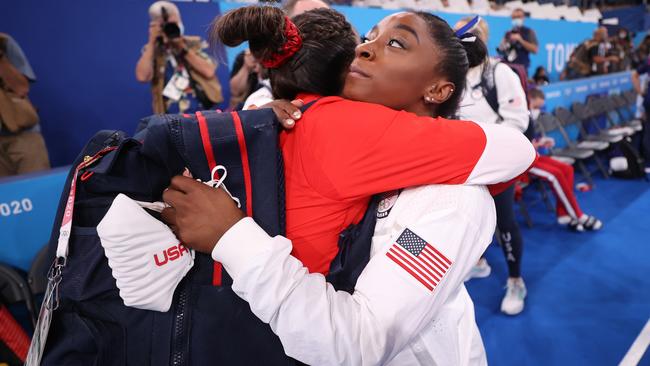 Biles embraces teammate Sunisa Lee after their competition. Picture: Getty Images