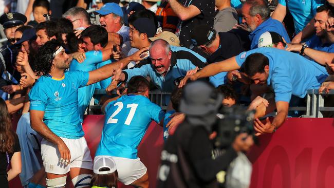 Uruguay celebrate with friends and family after their incredible upset. Picture: Getty