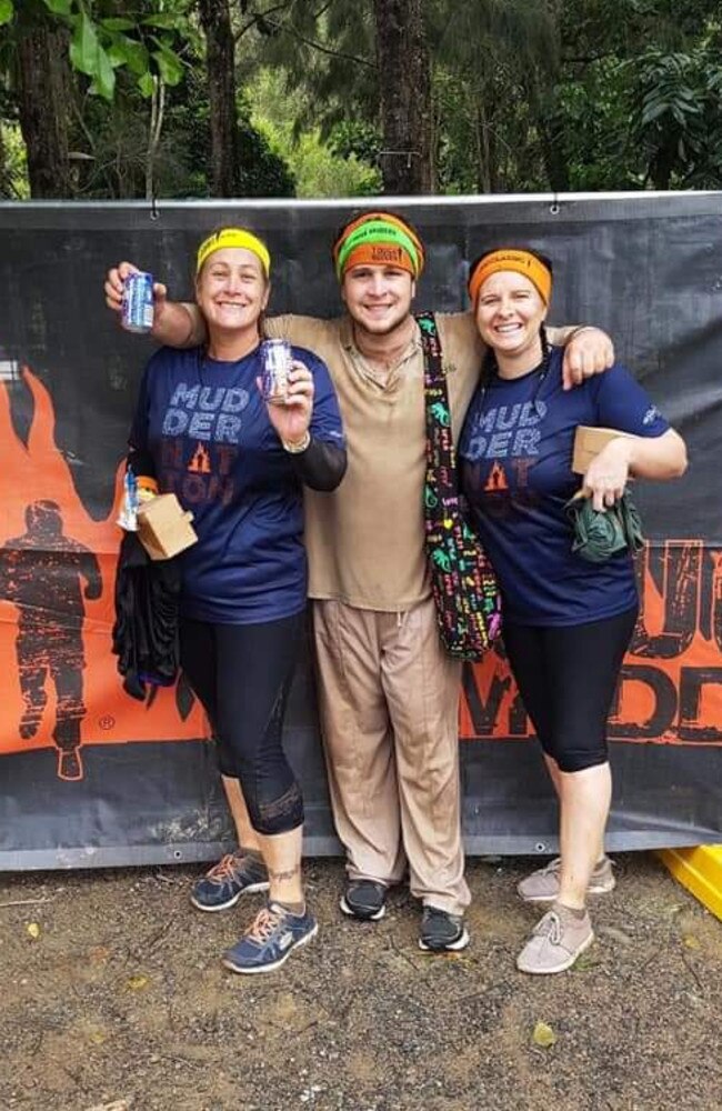 Bradley Homan (centre) wearing his not-so-white Tough Mudder outfit, with his mum Kerri Barbeler and sister-in-law Clerissa Barbeler. Picture: Supplied