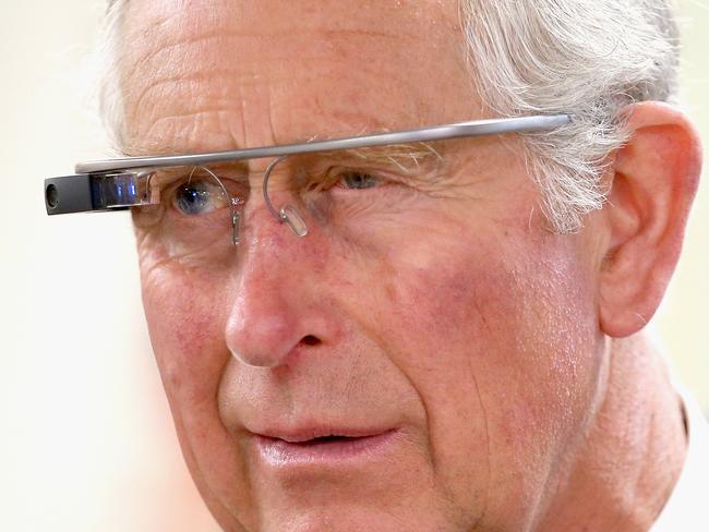 WINNIPEG, MB - MAY 21: Prince Charles, Prince of Wales tries on 'Google Glass' spectacles as he visits 'Innovation Alley' on May 21, 2014 in Winnipeg, Canada. The Prince of Wales and Duchess of Cornwall are on a four day visit to Canada. (Photo by Chris Jackson/Getty Images)