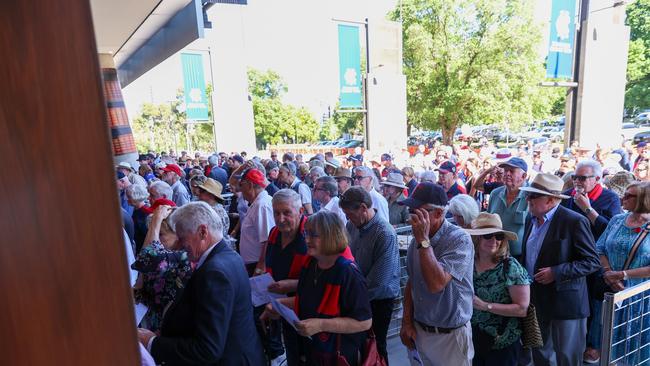 Patrons line up to enter the memorial service for Ron Barassi. Picture: Asanka Ratnayake