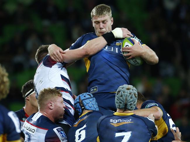 Super Rugby - Melbourne Rebels V Brumbies at AAMI Park , Brumbies Tom Staniforth gets a whack from Rebels Adam Thomson in the line out. 13th May 2016. Picture: Colleen Petch.