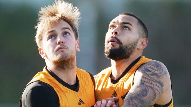 Harry Morrison of the Hawks (left) competes for the ball against Jarman Impey of the Hawks during an AFL Hawthorn Hawks training session at Waverley Park in Melbourne, Friday, June 26, 2020. (AAP Image/Michael Dodge) NO ARCHIVING