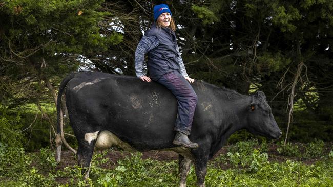 Veterinarian and dairy farmer Lucy Collins, 32, on her cow Fatty at Dixie in southwest Victoria. “I’ve always had a strong affinity for animals.” Picture: Nicole Cleary