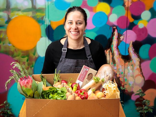 Sparkke at The Whitmore head chef Emma McCaskill with a Market Produce Box. Picture: SUPPLIED