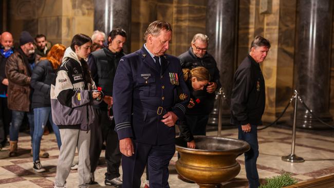 People place poppies inside The Shrine of Remembrance. Picture: Getty Images