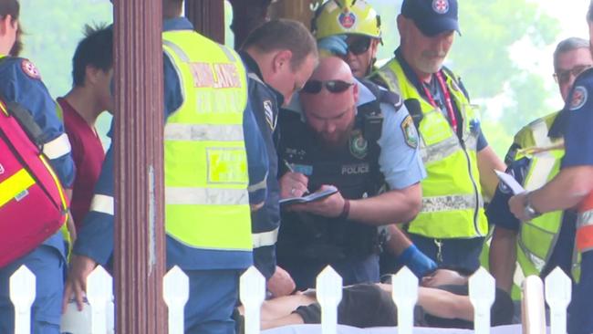 A police officer takes an injured passenger’s details. Picture: TNV