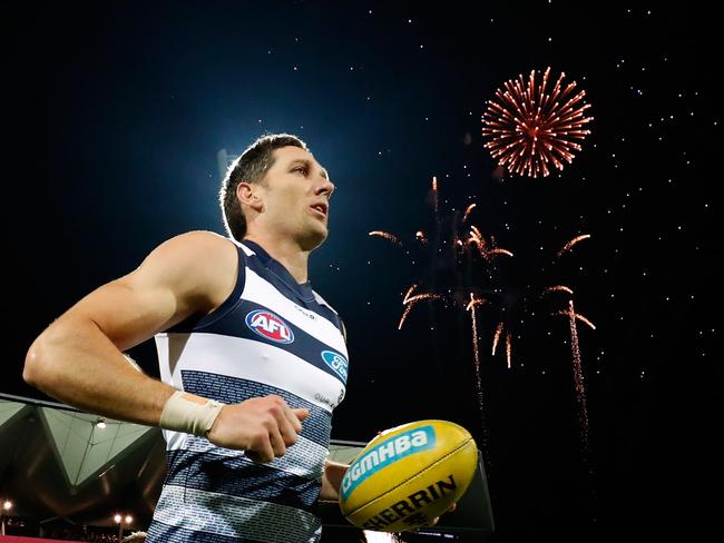 GEELONG, AUSTRALIA - MAY 19: Harry Taylor of the Cats runs out as fireworks go off to mark the opening of the new Brownlow stand during the 2017 AFL round 09 match between the Geelong Cats and the Western Bulldogs at Simonds Stadium on May 19, 2017 in Geelong, Australia. (Photo by Adam Trafford/AFL Media/Getty Images)