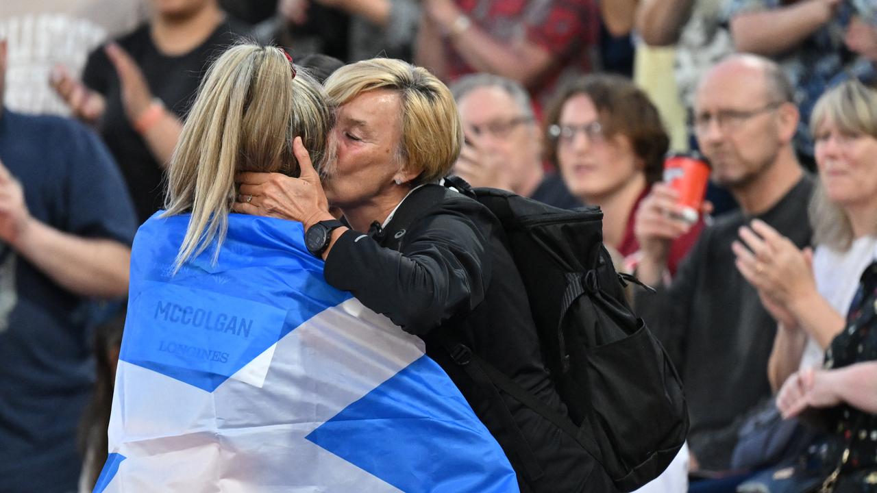 Scotland's Eilish McColgan celebrates with her mother after winning the women's 10,000m final. (Photo by Glyn KIRK / AFP)