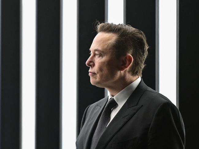 Tesla CEO Elon Musk is pictured as he attends the start of the production at Tesla's "Gigafactory" on March 22, 2022 in Gruenheide, southeast of Berlin. - US electric car pioneer Tesla received the go-ahead for its "gigafactory" in Germany on March 4, 2022, paving the way for production to begin shortly after an approval process dogged by delays and setbacks. (Photo by Patrick Pleul / POOL / AFP)