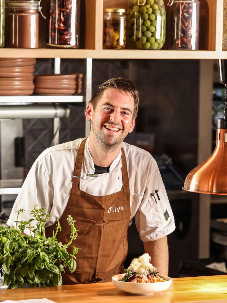 Callum Hann in his Olive restaurant kitchen with his gnocchi dish. Image/Russell Millard