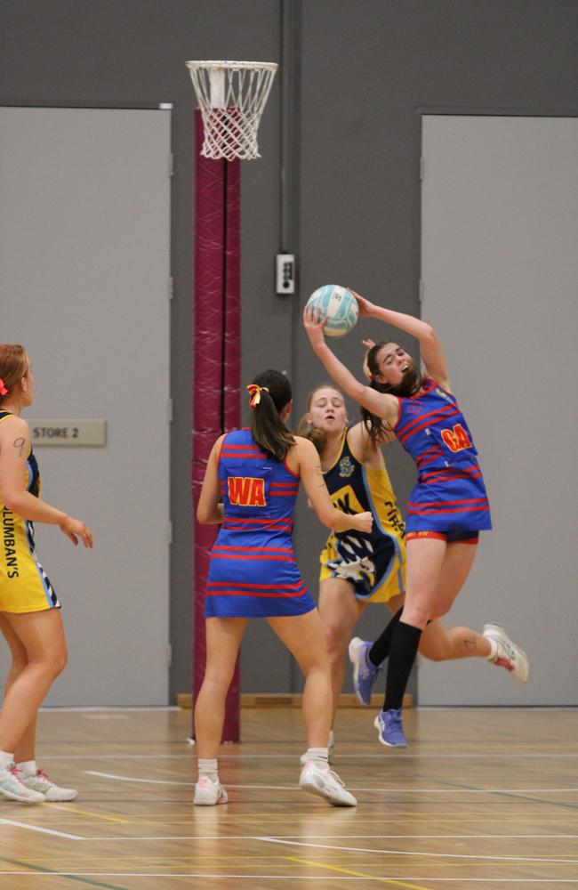 Netball action at QISSN 2024 held in Townsville. St Columbans College v Downlands College