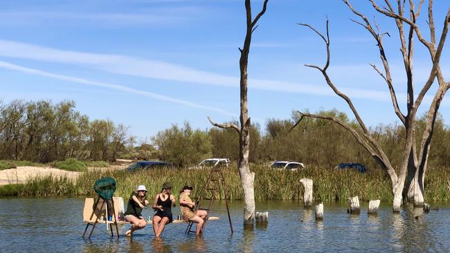 People enjoy a dip at Lake Bonney, Barmera.