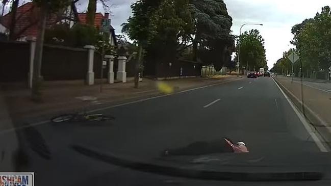 The cyclist lying on the ground. Picture: Dashcam Owners Australia