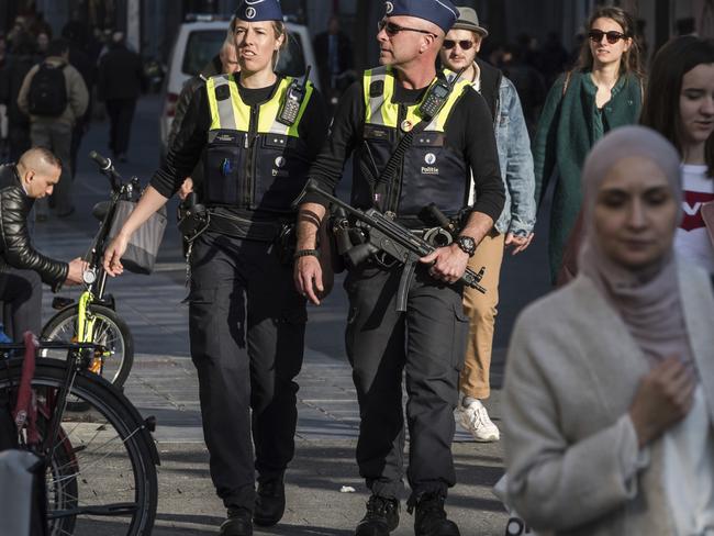 Police patrol Meir shopping street in Antwerp, Belgium after the car incident. Picture: AP Photo/Geert Vanden Wijngaert