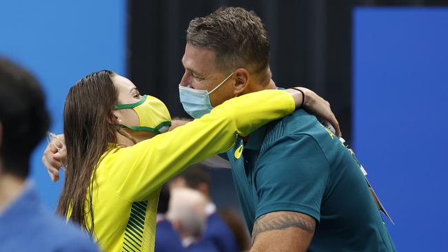 McKeown hugs coach Chris Mooney, with whom she has parted company, after winning gold in Tokyo. Picture: Alex Coppel