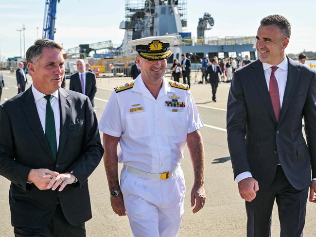 ADELAIDE, AUSTRALIA - NewsWire Photos MARCH 15, 2023: Acting Prime Minister Richard Marles, left, Vice Admiral Jonathan Mead, Chief of the Nuclear Powered Submarine Task Force and South Australian Premier Peter Malinauskas discuss the build of the AUSKUS submarines at the Osborne Naval Shipyard. Picture: NCA NewsWire / Brenton Edwards