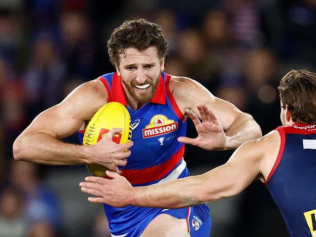 MELBOURNE, AUSTRALIA - AUGUST 02: Marcus Bontempelli of the Bulldogs evades Jack Viney of the Demons during the 2024 AFL Round 21 match between Footscray and the Melbourne Demons at Marvel Stadium on August 02, 2024 in Melbourne, Australia. (Photo by Michael Willson/AFL Photos via Getty Images)