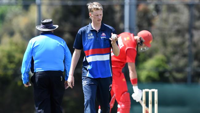 Premier: Footscray bowler Max Birthisel walks back to his mark. Picture: Steve Tanner