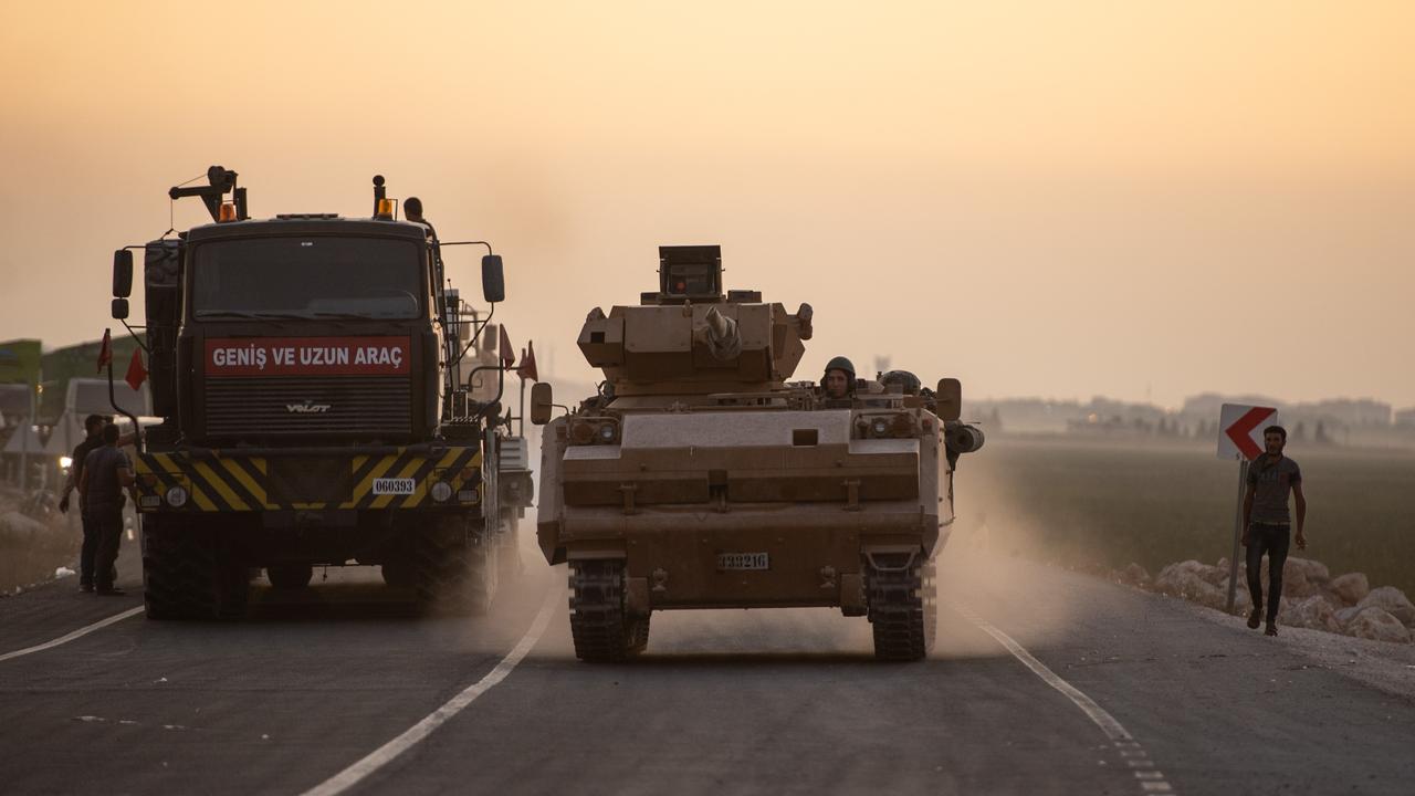 A Turkish armoured vehicles prepare to cross the border into Syria. Picture: Getty Images