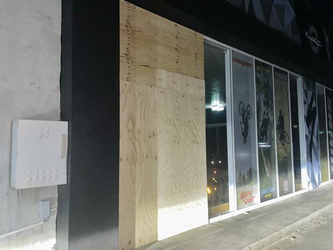 The side doors of the premises have been boarded up. Picture: Jack Colantuono