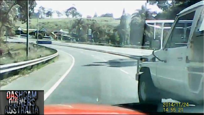 The ute cuts off a driver on the pacific highway, right outside the Big Banana. Picture: Dash Cam Owners Australia / Facebook