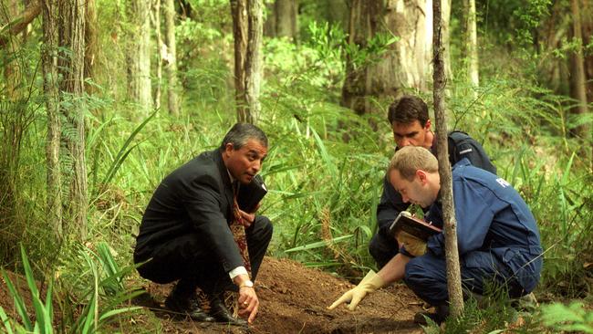 Police investigators at the makeshift gravesite in Marysville.