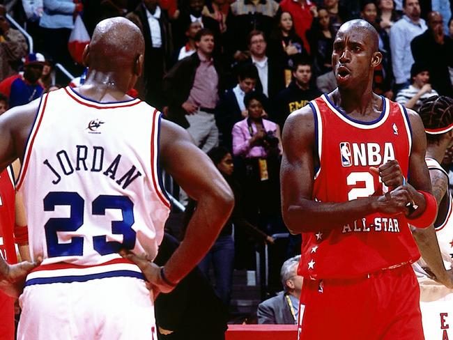 ATLANTA - FEBRUARY 9: Kevin Garnett #21 of the Western Conference All Stars talks with Michael Jordan #23 of the Eastern Conference All Stars during the 2003 NBA All-Star Game at the Phillips Arena on February 9, 2003 in Atlanta, Georgia. The West won 155-145 in the first ever double-overtime All-Star Game. NOTE TO USER: User expressly acknowledges and agrees that, by downloading and/or using this Photograph, User is consenting to the terms and conditions of the Getty Images License Agreement. Mandatory Copyright Notice: Copyright 2003 NBAE (Photo by Andrew D. Bernstein/NBAE via Getty Images)