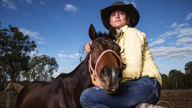 Meg Everett with her horse Teemak Pistol Knight at home on her family property outside Katherine. Picture: Lachie Millard