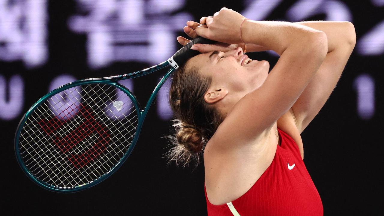 Belarus' Aryna Sabalenka celebrates after victory against China's Zheng Qinwen during their women's singles final match on day 14 of the Australian Open tennis tournament in Melbourne on January 27, 2024. (Photo by David GRAY / AFP)