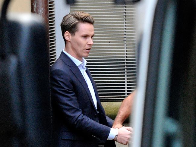 Appeal ... Stockbroker Oliver Curtis is escorted to a prison van to begin his sentence.