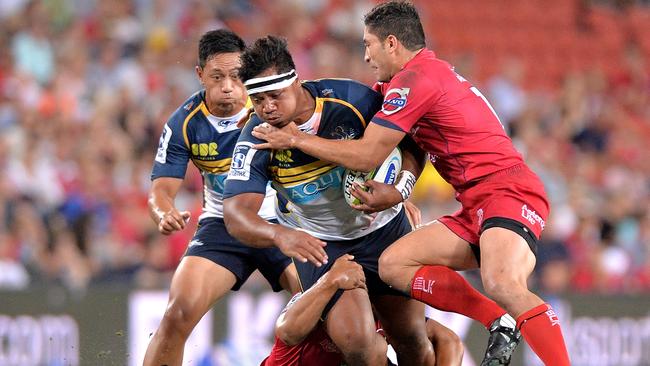 Ita Vaea of the Brumbies attempts to break through the defence.