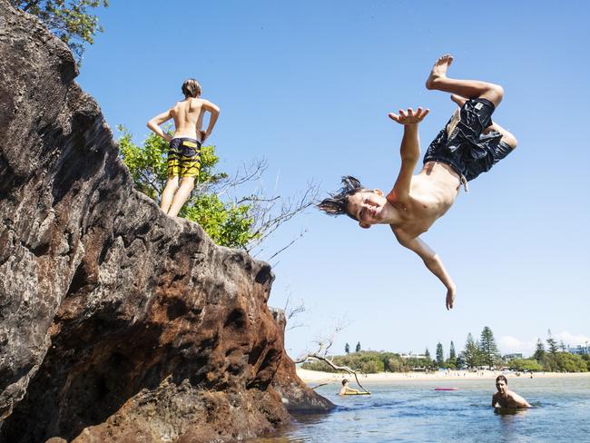 On the coast, temperatures will be less severe. Twelve-year-old Lleyton Pollard from Wurtulla, takes the plunge at Currimundi Lake. Picture: Lachie Millard