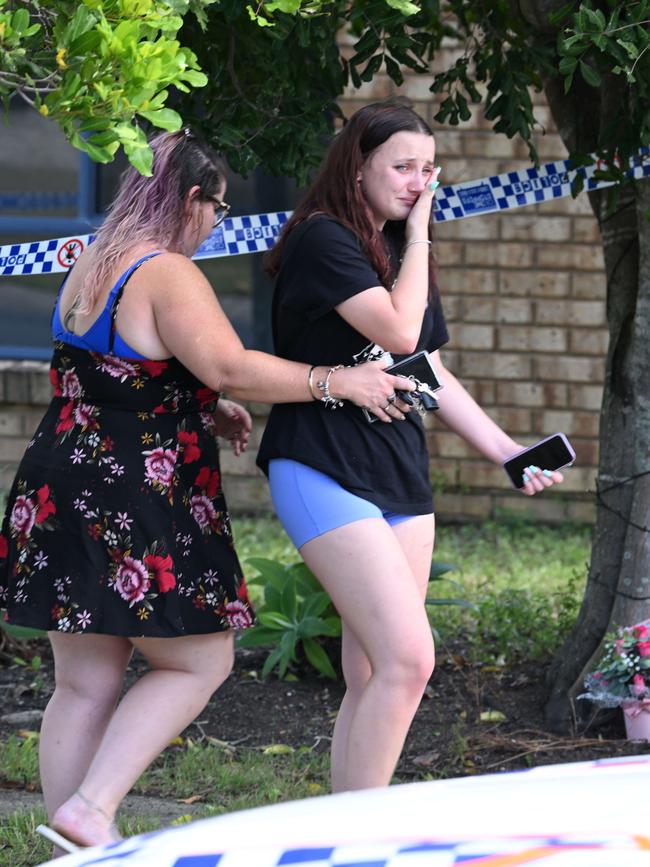 Mourners at the scene of Emma Lovell’s slaying