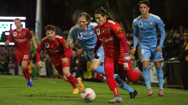 Campbelltown City’s Japanese winger Yoshei Matsumoto beats Melbourne City’s Harrison Delbridge during this year’s FFA Cup clash at Newton. Picture: Alex Aleshin